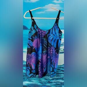 Swimming Suit in Floral Blues, Purple, and Black with solid black trunks. Medium
